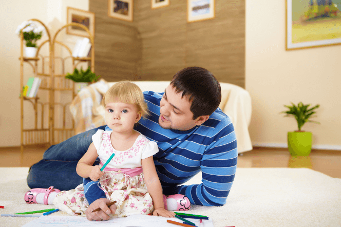 father and child sitting together discussing rules